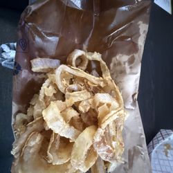 This is my nasty onion rings that I threw away. I wouldn't even feed these to my dog. I will never be back to this trash restaurant again!