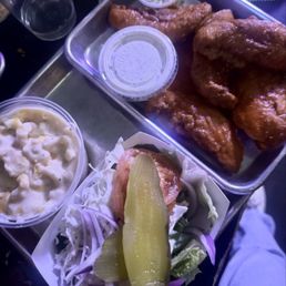 Buffalo chicken tenders plate with side of mac n cheese. Nice surprise with complementary side of coleslaw & pickles