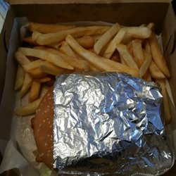WNB Factory Wings & Burger - Nice sized burger wrapped in foil with fries