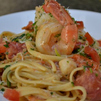Junction - a plate of pasta with shrimp and tomatoes - Music Venues Near Me - Calgary, Alberta Junction - a plate of pasta with shrimp and tomatoes - Music Venues Near Me - Calgary, Alberta