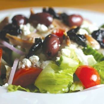 Sakis - a white plate with a salad on it - Mediterranean Near Me - Burlington, Ontario