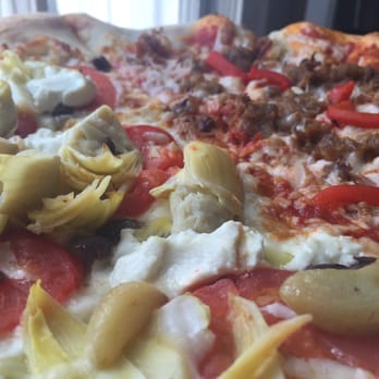 Lola's - Artichoke & goat cheese with roasted garlic, oven roasted tomatoes and Kalamata olives. - Pizza Near Me - Charleston, West Virginia Lola's - Artichoke & goat cheese with roasted garlic, oven roasted tomatoes and Kalamata olives. - Pizza Near Me - Charleston, West Virginia
