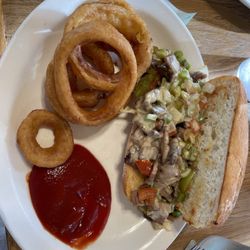 Mustang Cafe & BBQ - Brisket Philly sandwich and onion rings.