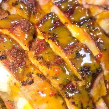 Racks BBQ - a closeup of a grilled chicken - Food Trucks Near Me