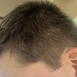 Dad & Lad Barber Shop - Random stray hairs and straight cut sideburn.