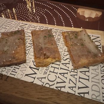 Bazaar Meat by José Andrés - SOBRASADA TOAST $13 pan cristal, drunken goat cheese, honey, chives - Steakhouses Near Me - Las Vegas, Nevada Bazaar Meat by José Andrés - SOBRASADA TOAST $13 pan cristal, drunken goat cheese, honey, chives - Steakhouses Near Me - Las Vegas, Nevada