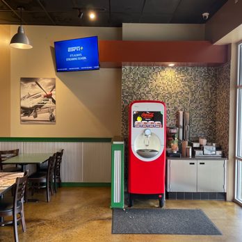 Wingstop - a red vending machine in a restaurant - Chicken Wings Near Me - Bryant, Arkansas Wingstop - a red vending machine in a restaurant - Chicken Wings Near Me - Bryant, Arkansas