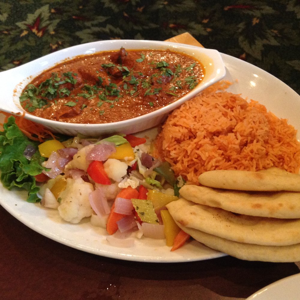 Butter Chicken entree with basmati rice, naan, and a vegetable medley Butter Chicken entree with basmati rice, naan, and a vegetable medley