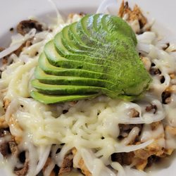 El Corcel 3 - Steak and chicken with onions, shredded cheese, and avocado