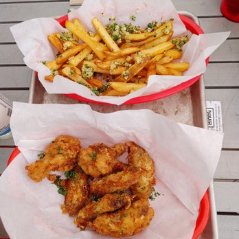 Red Truck Beer - two baskets of chicken wings and french fries - Breweries Near Me - Vancouver, British Columbia Red Truck Beer - two baskets of chicken wings and french fries - Breweries Near Me - Vancouver, British Columbia
