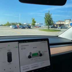 Tesla Supercharger - Starbucks down by the trees. Culver's close but limited hours.