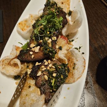 HEW Parlor & Chophouse - Pork belly...it's a bit spicy and interesting with the bed of pickled veg - Steakhouses Near Me - Dunedin, Florida