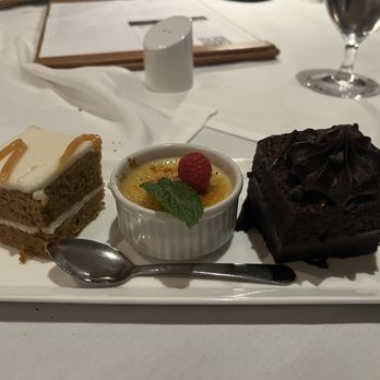 Eddie Merlot's - Dessert trio: Carrot cake, Crème brulee, Chocolate cake - Steakhouses Near Me - Lincolnshire, Illinois Eddie Merlot's - Dessert trio: Carrot cake, Crème brulee, Chocolate cake - Steakhouses Near Me - Lincolnshire, Illinois