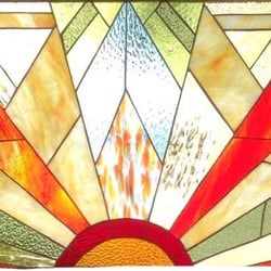 Crisp - From the owner's Facebook - the new beautiful stained glass on the facade.