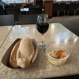 Warm pita with humus and a glass of wine - nice way to relax on the town square. Warm pita with humus and a glass of wine - nice way to relax on the town square.