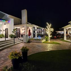 Garrison Kitchen + Cocktails - Angle of indoor dining connection to kitchen and patio