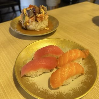 Chubby Ninja - Salmon and tuna nigiri with sushi tower in the back - Sushi Bars Near Me - Middletown, Kentucky Chubby Ninja - Salmon and tuna nigiri with sushi tower in the back - Sushi Bars Near Me - Middletown, Kentucky