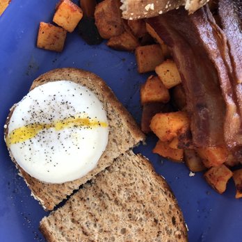 Over Easy Cafe - 2 poached eggs with bacon and hash browns. - Breakfast & Brunch Near Me - Sanibel, Florida Over Easy Cafe - 2 poached eggs with bacon and hash browns. - Breakfast & Brunch Near Me - Sanibel, Florida