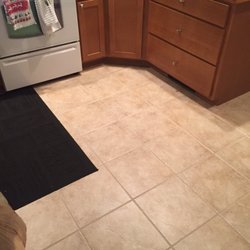 Floors & More - The tile work complements the kitchen cabinetry and the wood floors.  Couldn't be happier.