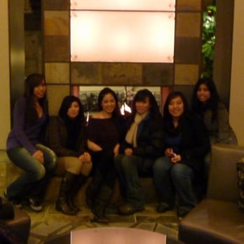 Newpark Resort - kinda blurry, but gettin cozy in front of the lobby fireplace - Hotels Near Me - Park City, Utah