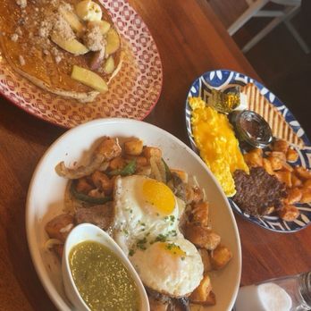 The Rooted Fork - Apple fritter pancakes, over easy eggs with bistec beef, potatoes and onions and green salsa, scrambled eggs, beef bistec and potatoes - Coffee & Tea Near Me - Cibolo, Texas