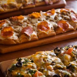 The KROW Sports Bar & Grill - Flat bread pizza's that to die for :-). Meatlovers, Nacho, BBQ chicken!