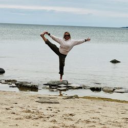 Rock Island State Park - Me doing yoga on a rock in the lake.