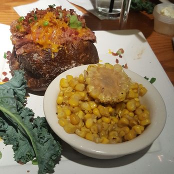 Bobby Q - Mesa - Loaded brisket potato and roasted corn - New American Near Me - Mesa, Arizona Bobby Q - Mesa - Loaded brisket potato and roasted corn - New American Near Me - Mesa, Arizona
