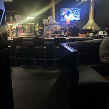 Pizzeria Sprezza - Picture of the bar with a tv to watch in front of it. - Pizza Near Me - Euless, Texas