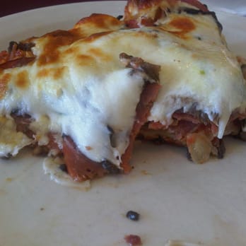 Pizza Pino - Half eaten slice - Pizza Near Me - Ajax, Ontario Pizza Pino - Half eaten slice - Pizza Near Me - Ajax, Ontario