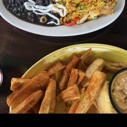 Arroz Con Pollo and yucca fries Arroz Con Pollo and yucca fries