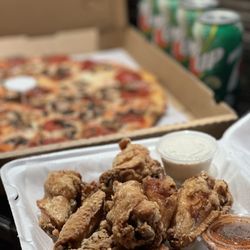 Pinball Pizza - Family Special: 12 Jumbo Buffalo Wings, Large Pizza, 4 cans soda of choice.