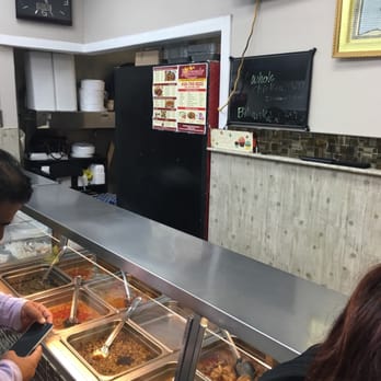 Kashmir Curry and Biryani Restaurant - a woman ordering food - Indian Near Me - Etobicoke, Ontario Kashmir Curry and Biryani Restaurant - a woman ordering food - Indian Near Me - Etobicoke, Ontario