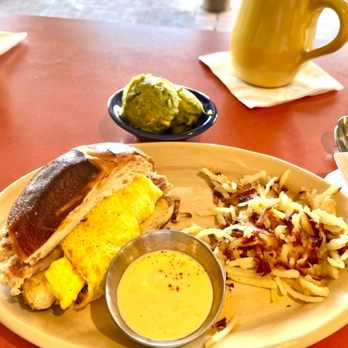 Snooze, an A.M. Eatery - Shared egg sandwich with a side of avocado. - Breakfast & Brunch Near Me - Phoenix, Arizona