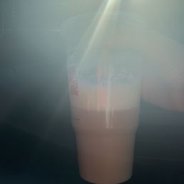 a drink in a plastic cup a drink in a plastic cup