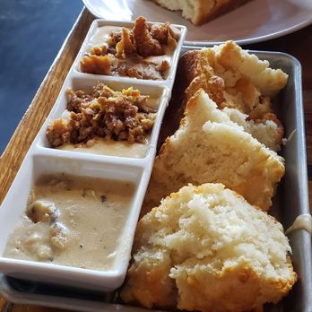Biscuit Head - Gravy Flight *top to bottom* (fried chicken gravy, sausage gravy, shittaki mushroom and black pepper gravy) and an extra large side biscuit - Breakfast & Brunch Near Me - Greenville, South Carolina