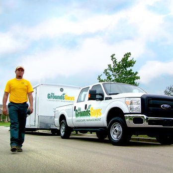 The Grounds Guys of Georgetown - a man walking in front of a moving truck - Landscape Architects or Designers Near Me The Grounds Guys of Georgetown - a man walking in front of a moving truck - Landscape Architects or Designers Near Me