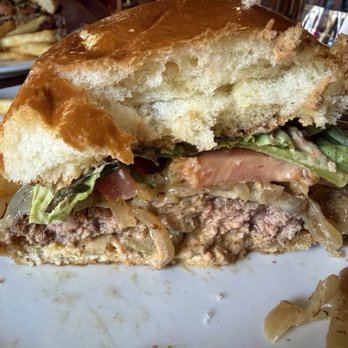 Bear & Crown - Side view of the Pup burger. It needed more seasoning. It was bland even with the grilled onions and pickles. - Pubs Near Me - Sacramento, California
