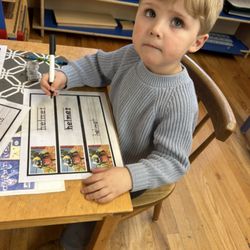 Olympic View Montessori - Working on writing . Tracing words and attempting to write themselves.