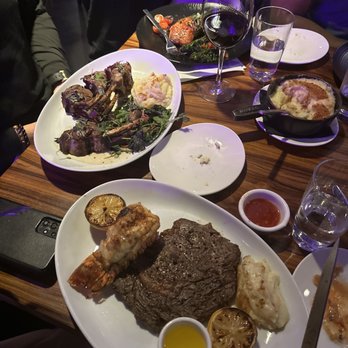 STK Steakhouse Bellevue - Ribeye* Roasted Lamb Rack and Maple Rubbed Salmon* - Steakhouses Near Me - Bellevue, Washington STK Steakhouse Bellevue - Ribeye* Roasted Lamb Rack and Maple Rubbed Salmon* - Steakhouses Near Me - Bellevue, Washington
