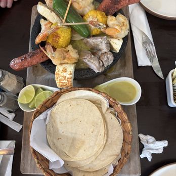 Cielito Lindo - Molcajete de Piedra Caliente Parrillada (regional dish; basically a mixed grill in a stew with tortillas?) - Mexican Near Me - Cozumel, ROO Cielito Lindo - Molcajete de Piedra Caliente Parrillada (regional dish; basically a mixed grill in a stew with tortillas?) - Mexican Near Me - Cozumel, ROO