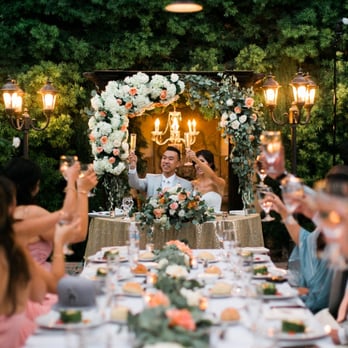 Irises Designs - The wedding arch was moved after our ceremony and put behind our sweetheart table. - Floral Designers Near Me - Rancho Cucamonga, California Irises Designs - The wedding arch was moved after our ceremony and put behind our sweetheart table. - Floral Designers Near Me - Rancho Cucamonga, California