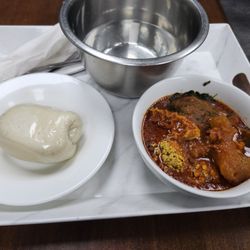 9ja Buka - The meal. "Bread" on left, washing bowl in back.