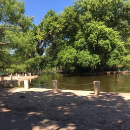 Mostly shaded seating areas around the duck pond at 7th street.