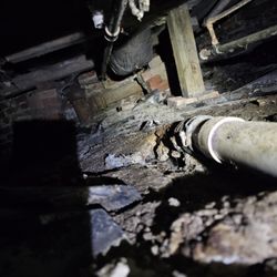 Frazier Plumbing - Replace broken drain under house where cast iron pipe rusted out and leaking.