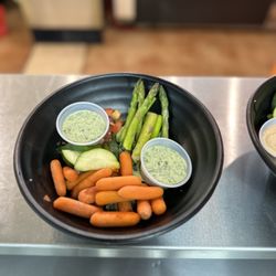 Clean Eatz - Kale and Quinoa vegetarian bowl - with asparagus, cucumbers, carrots, and corn and black bean.  Goddess sauce on the side.