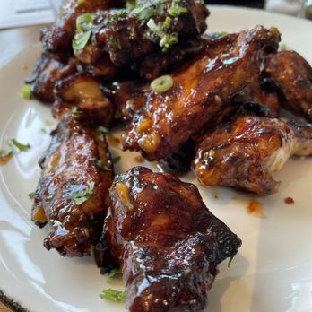 A-Side Public House - A-Side Wings - Cola marinated and fried. Tossed in chili's, garlic, lemongrass and ginger. Topped with cilantro and green onion. - Coffee & Tea Near Me - Saint Paul, Minnesota A-Side Public House - A-Side Wings - Cola marinated and fried. Tossed in chili's, garlic, lemongrass and ginger. Topped with cilantro and green onion. - Coffee & Tea Near Me - Saint Paul, Minnesota