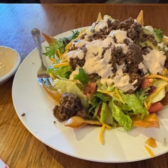 The Outpost Steakhouse - Taco salad with dressing - Steakhouses Near Me - Burney, California The Outpost Steakhouse - Taco salad with dressing - Steakhouses Near Me - Burney, California