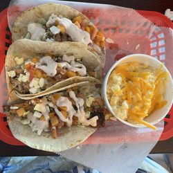 The Sandbar Sunset Bar & Grill - Blackened fish tacos and cheese grits
