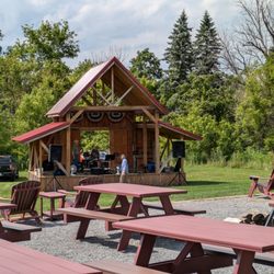 Madison County Distillery - Partially covered patio (shade is behind me) and band platform